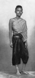 In mid-19th century Siam, both men and women wore wore similar hairstyles, with the head shaved except for a round tuft on the crown which was spiked like a brush. Both sexes also wore mid-length trousers, or 'pha nung', which were supported by a belt, often made from silver. Middle and upper-class women generally wore a sarong or cloth over their left shoulder to cover their breast, leaving their right arm free. Before this time, the midriff and chest were usually left exposed with tattoos decorating the torso.