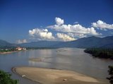 The Golden Triangle designates the confluence of the Ruak River and the Mekong River; the junction of Thailand, Laos and Myanmar.<br/><br/>


The Mekong is the world's 10th-longest river and the 7th-longest in Asia. Its estimated length is 4,909 km (3,050 mi)  and it drains an area of 795,000 km2 (307,000 sq mi), discharging 475 km3 (114 cu mi) of water annually.<br/><br/>


From the Tibetan Plateau the Mekong runs through China's Yunnan province, Burma, Laos, Thailand, Cambodia and Vietnam.