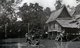 Thailand: A traditional Siamese house on stilts on a canal in Bangkok Noi, c. 1900