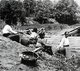 Thailand: Women stop for a rest on a riverbank near Uttaradit, northern Thailand, c. 1900.