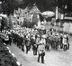 Thailand: King Chulalongkorn is carried through the street in his litter near Wat Bowannivet in Bangkok during the Thot Kathin ceremony, c. 1900.